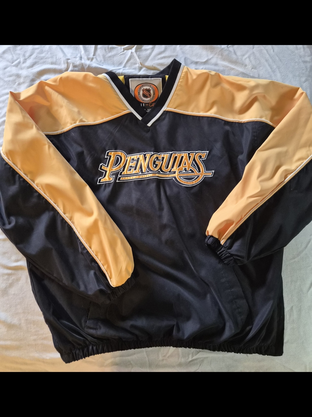 NHL Pittsburgh Penguins Black and Gold Windbreaker